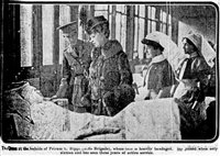 Queen Mary speaks to an injured serviceman at Sidcup