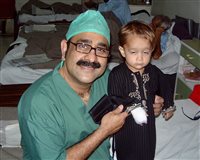 Haroon with a young victim