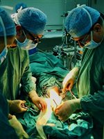 In theatre, Rawalpindi. Omar Ahmed and Samir al Ali. Jill Horner is the scrub nurse